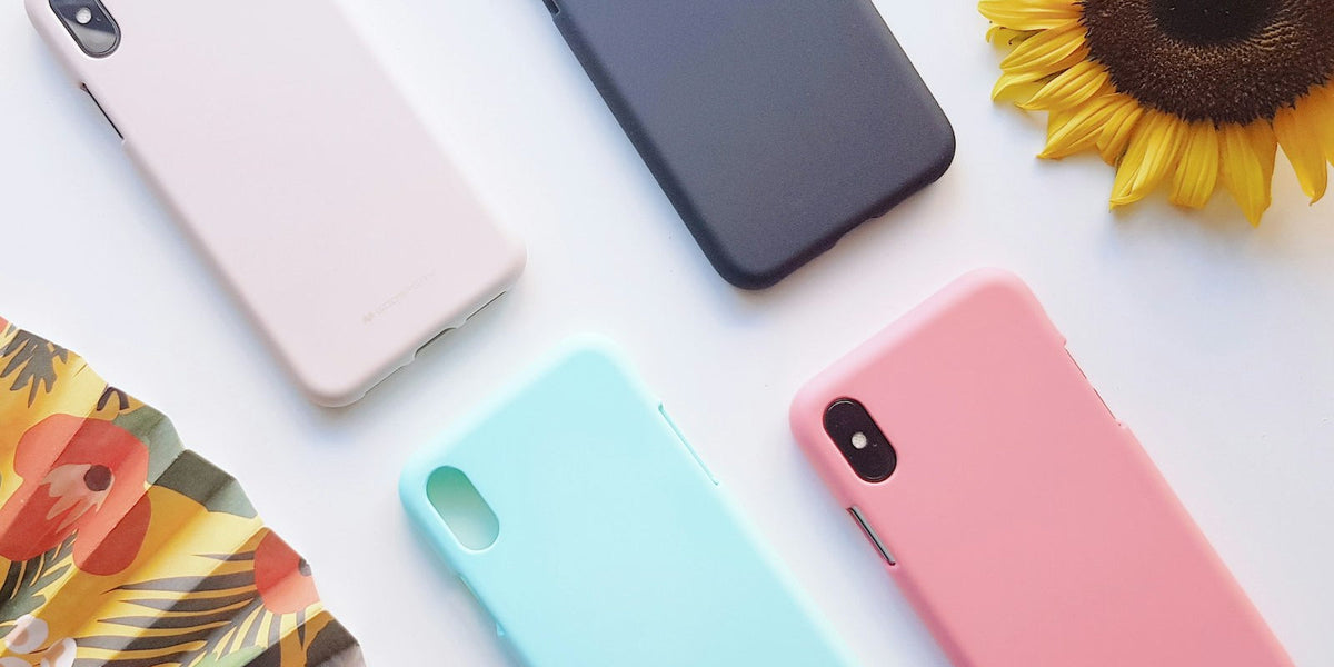 Four different colored smartphone cases arranged side by side