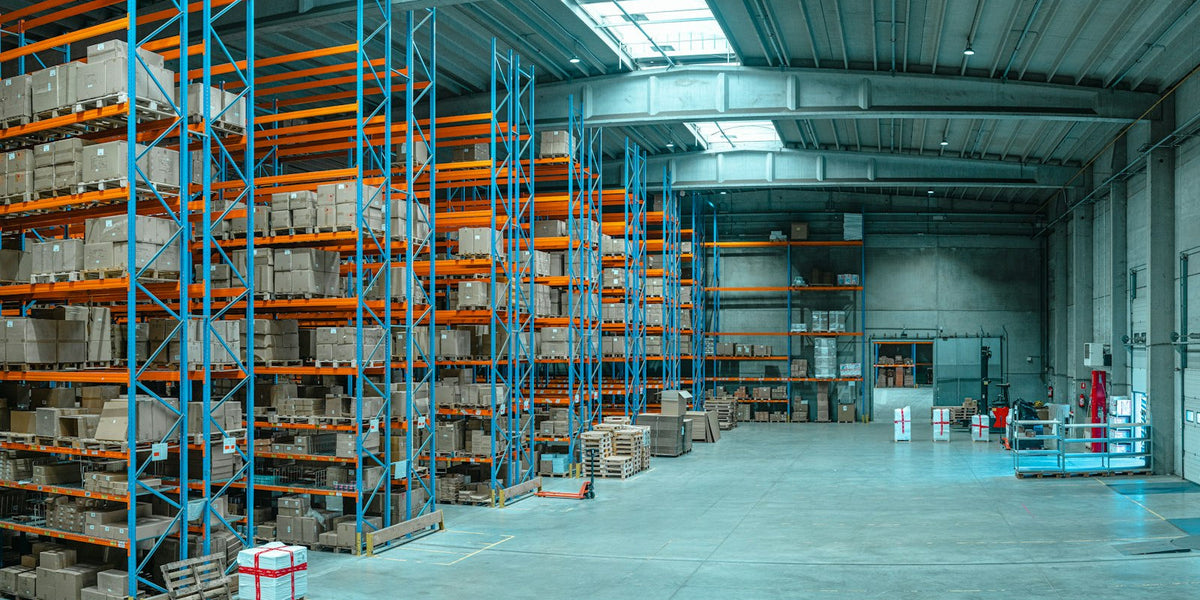 Tall warehouse shelving stocked with boxes, representing wholesale phone accessory supplier evaluation