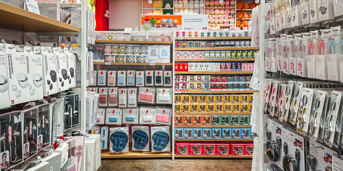 Retail store shelves stocked with a variety of phone accessories